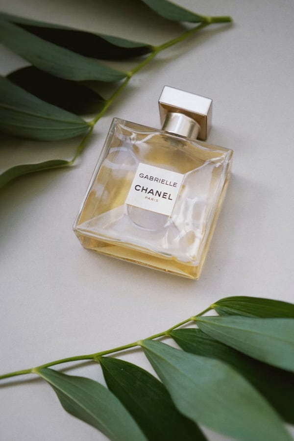 A bottle of Chanel Gabrielle Eau de Parfum sitting on a table.